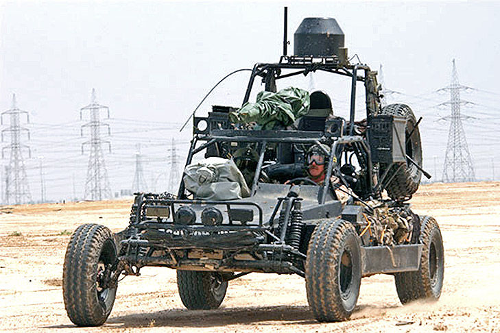 DPV-SEALs-travel-in-a-Desert-Patrol-Vehicle-(DPV)-in-Kuwait,-2002.-The-DPVs-weapons-are-covered-to-protect-them-from-dust.-US-Navy-photo-by-Photographer's-Mate-1st-Class-Arlo-Abrahamson