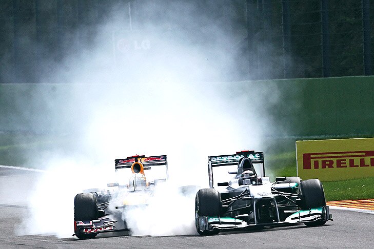 Belgian Grand Prix - Race Day - Spa Francorchamps, Belgium. (L to R): Sebastian Vettel (GER) Red Bull Racing RB8 and Michael Schumacher (GER) Mercedes AMG F1 W03 battle for position