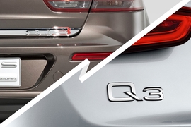 Schriftzug Qoros Limousine und Audi Q3