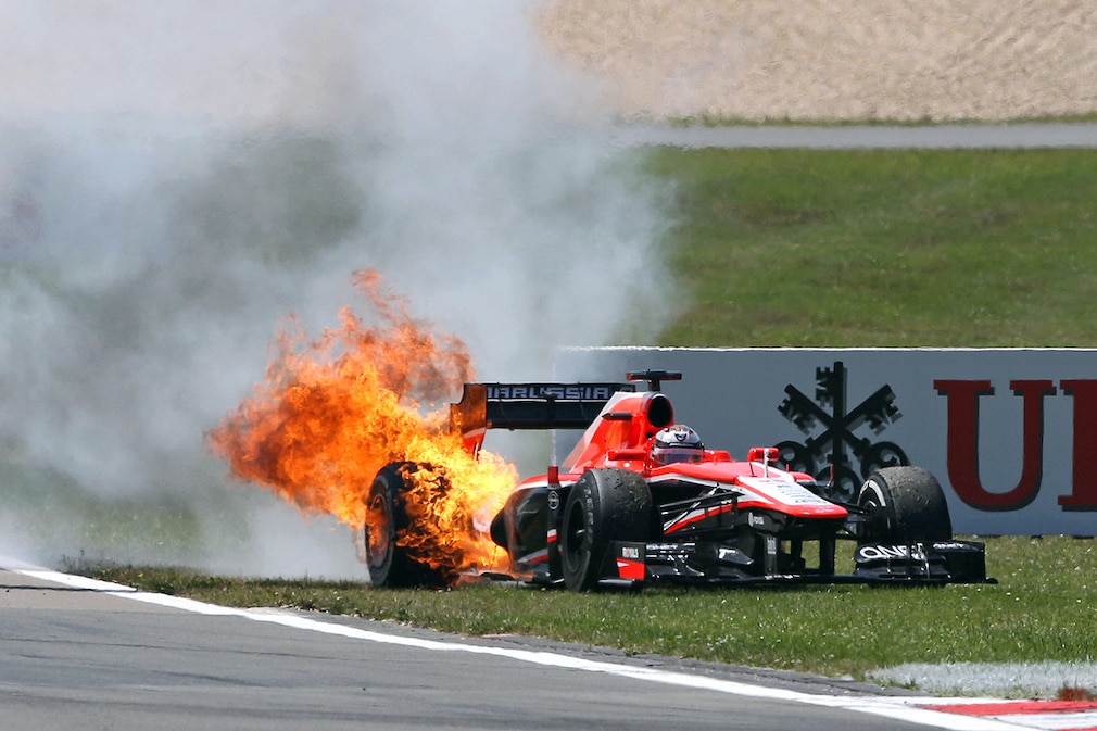 The car of French Formula One driver Jules Bianchi of Marussia catches fire during the Grand Prix of Germany at the Nuerburgring