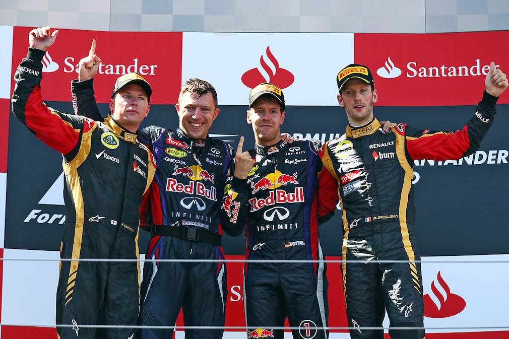 (L to R) Kimi Raikkonen (FIN) Lotus F1 Team, second; Sebastian Vettel (GER) Red Bull Racing, race winner; Romain Grosjean (FRA) Lotus F1 Team