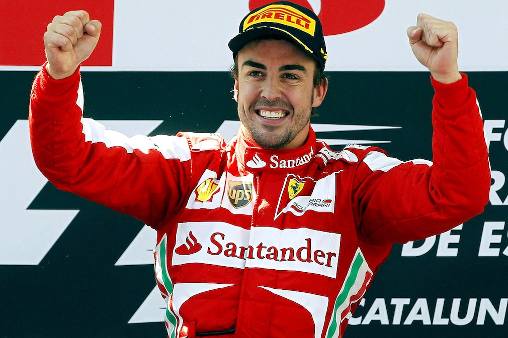 Spanish Formula One driver Fernando Alonso of Scuderia Ferrari jubilates at the podium his victory in the 2013 Formula One Grand Prix of Spain