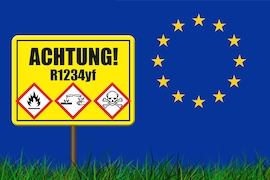 Kältemittel-Warnschild vor EU-Emblem