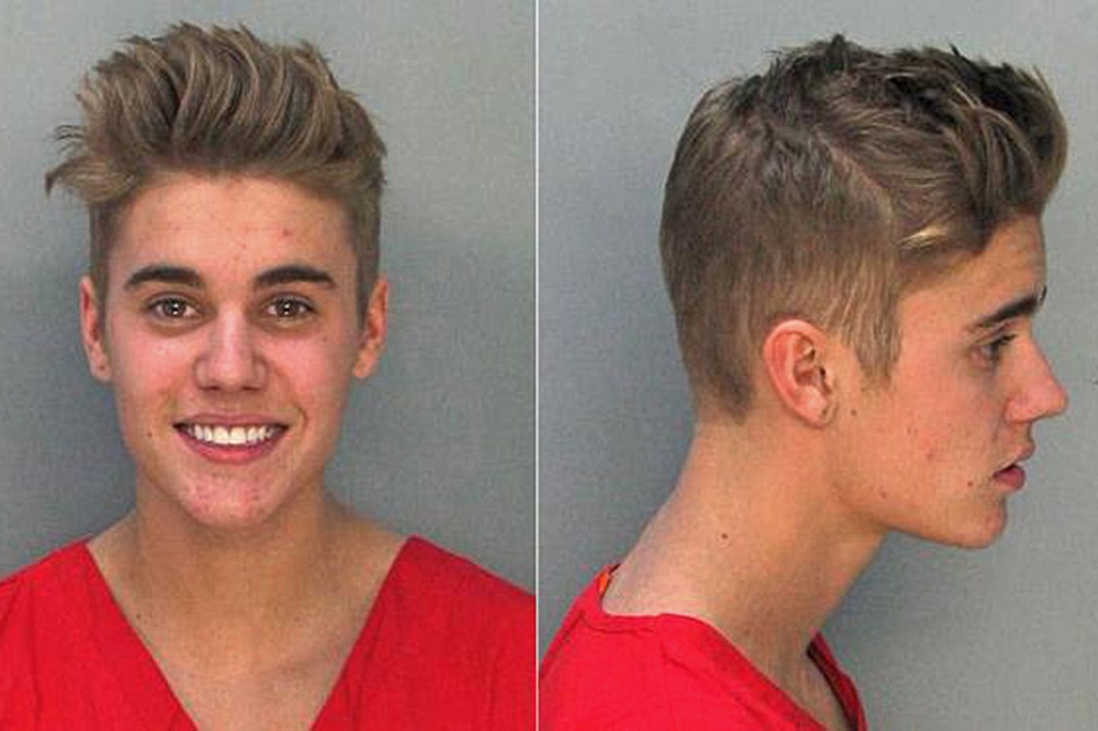 Pop star JUSTIN BIEBER was arrested by Miami Police Department for suspicion of drunk driving DUI. The pop star was arrested early Thursday for drag racing and DUI in Miami Beach. R&B artist Khalil was also arrested. Bieber was in a rented yellow Lamborghini. Khalil was in a red Ferrari. Bieber, 19, was booked at Miami Beach police station on charges of driving under the influence, driving with an expired license and resisting arrest 'without violence.' He is listed as being 5-foot-9 and 140 pounds
