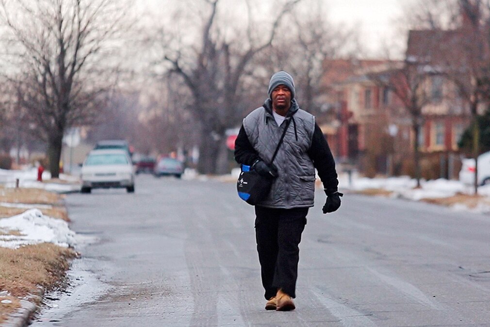 Jan. 30 2015, Detroit, MI, USA - James Robertson, 56, of Detroit, walks toward Woodward Ave. to catch his morning bus to Somerset Collection in Troy before walking to his job at Schain Mold & Engineering in Rochester Hills on Thursday, Jan. 29, 2015 in Detroit.