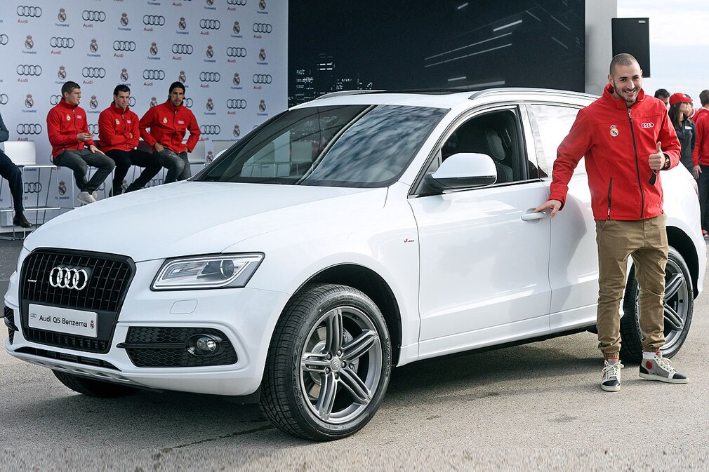 Real Madrid's player Karim Benzema receives a new Audi Q5 during a promotion event for delivering Audi vehicles to each team player of the Spanish Primera Division soccer club at Valdebebas Sports City in Madrid