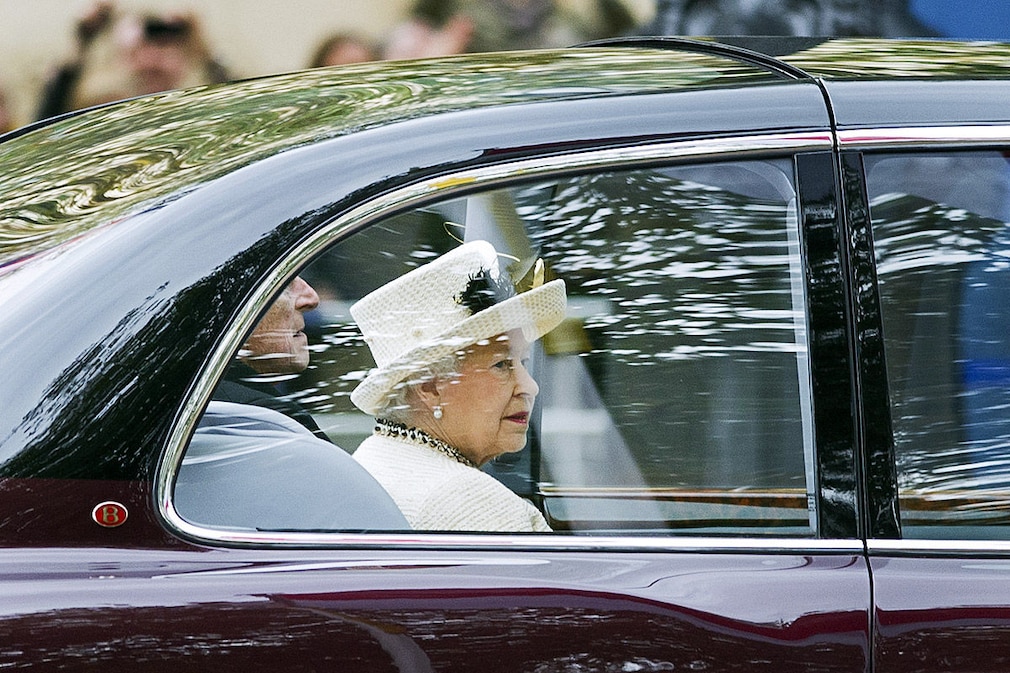 Britain's Queen Elizabeth II and Prince Philip, Duke of Edinburgh travel by car to Horseguards Parade for a ceremony to welcome Indonesian President Susilo Bambang Yudhoyono in central London on October 31, 2012