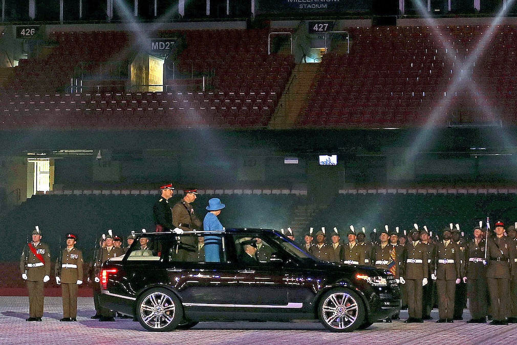 Her Majesty The Queen inspect's troops from The Royal Welsh in her new open top range rover as the attend's the Colours Parade for The Royal Welsh at the Millennium Stadium