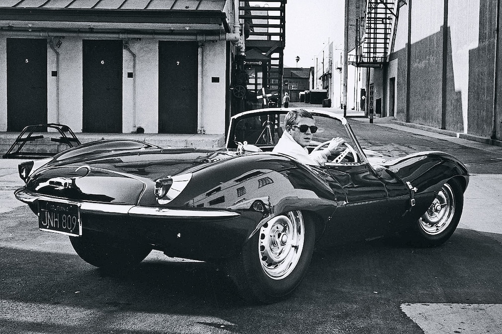 Actor Steve McQueen driving in a sports car in California June 1963