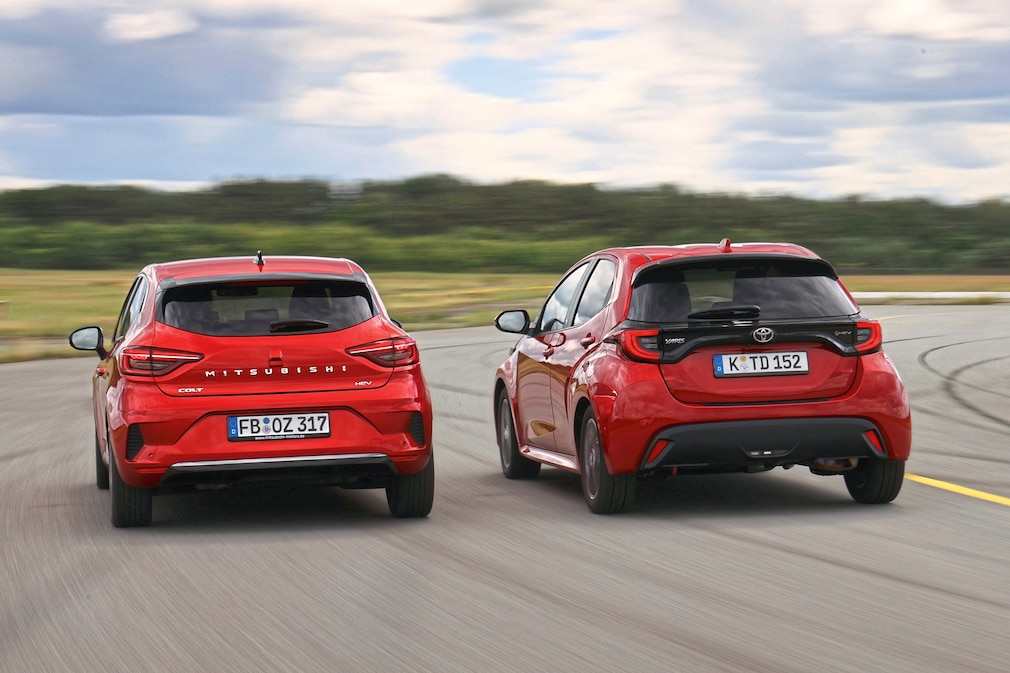 Mitsubishi Colt Hybrid 1.6  Toyota Yaris Hybrid 116