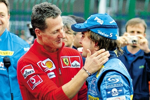 Rekordweltmeister gratuliert Doppel-Weltmeister: 2005 und 2006 holte Fernando Alonso den Titel.