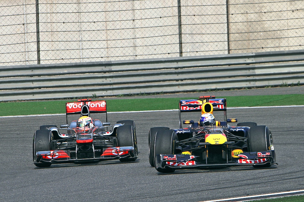 Lewis Hamilton (GBR) McLaren Mercedes and Sebastian Vettel (GER) Red Bull Racing