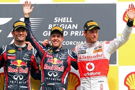 German Formula One driver Sebastian Vettel (C) of Red Bull Racing celebrates his victory on the podium with second placed Australian Formula One driver Mark Webber ( L) of Red Bull Racing