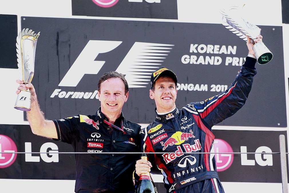 German Formula One driver Sebastian Vettel (R) of Red Bull Racing celebrates with Red Bull team principal Christian Horner after winning the Formula One Grand Prix of South Korea